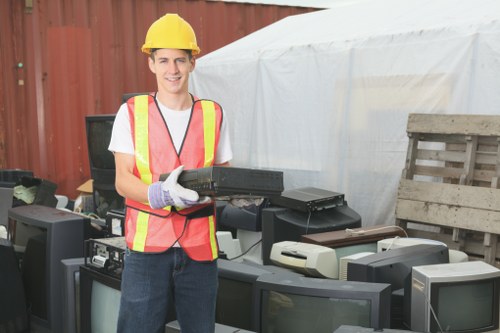 Charity volunteers receiving furniture for reuse